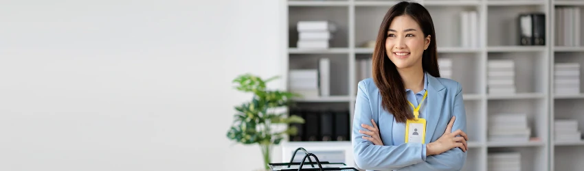 Public administration professional standing in her office.